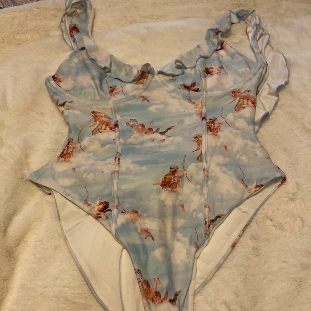 Weworewhat baby angels one piece very sexy one piece. I wore this once.